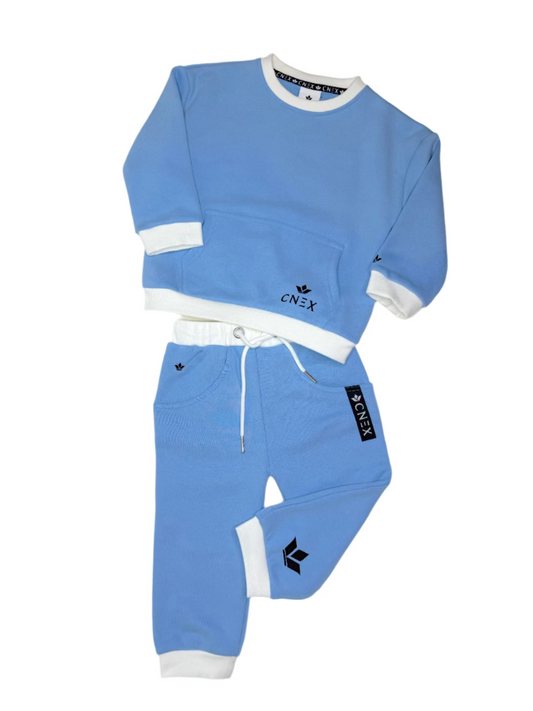 Blue children's tracksuit with white accents on a light gray background