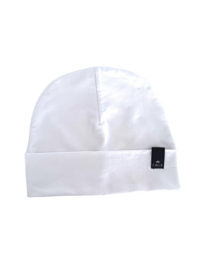 White beanie with a brand logo on a light gray background