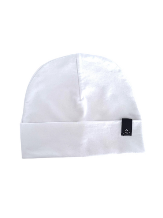 White beanie with a brand logo on a light gray background